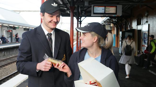 Macarthur Adventist College Year 12 student Brendan Hall enjoys a sausage roll on the way to school.