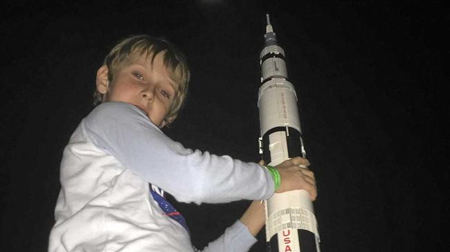 LAUNCH TIME: William Hartley points his Lego Saturn V rocket toward the moon to coincide with 50th anniversary of the launch of the Apollo 11 moon mission.