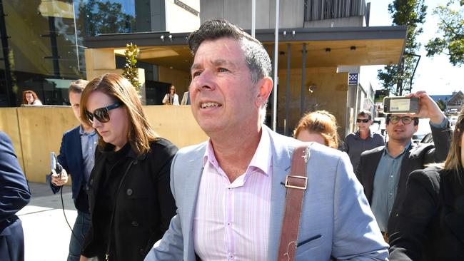 Former Ipswich Mayor Andrew Antoniolli (right) and his wife Karina (left) are seen leaving the Ipswich Magistrates Court in Ipswich, Friday, August 9, 2019. (AAP Image/Darren England)