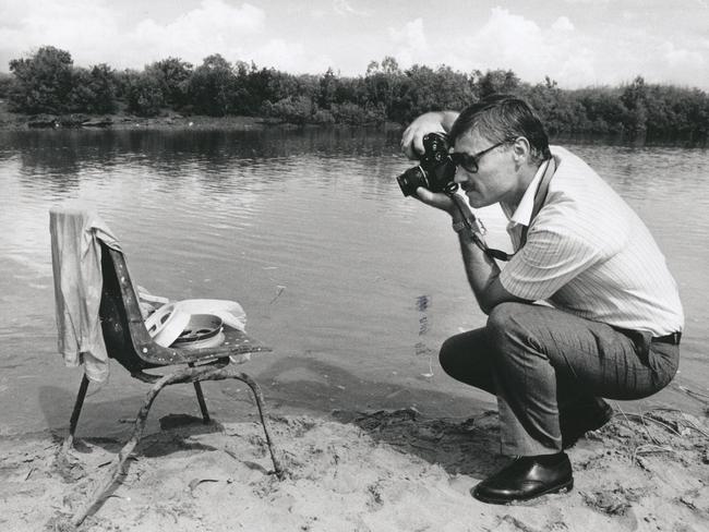 Constable Kym Chilton of the police forensic department photographs the fishing equipment left on the Rapid Creek bank, the discovery of these abadoned items has raised fears that someone may have been taken by a crocodile.