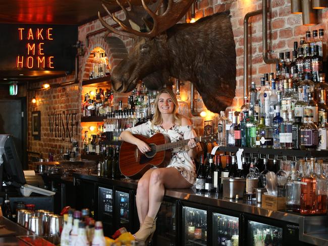 Brooke Lambert is a local artist who will be performing at Groundwater Country Music Festival at Broadbeach. Brooke and her guitar at The Loose Moose at Broadbeach. Picture Glenn Hampson