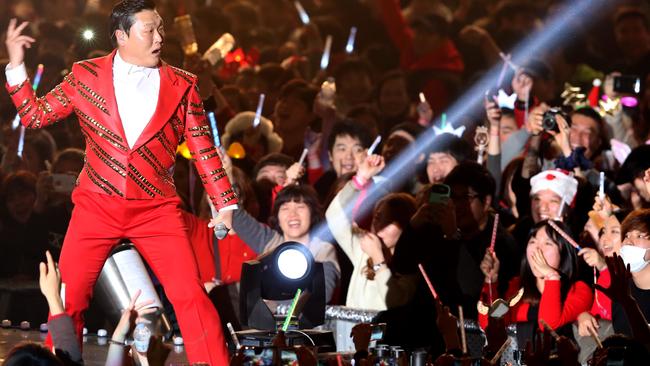 South Korean rapper Psy performs during a concert at the Jamsil Gymnastics Stadium in Seoul, South Korea, December 2013. Picture: AAP Image/Yonhap News Agency.