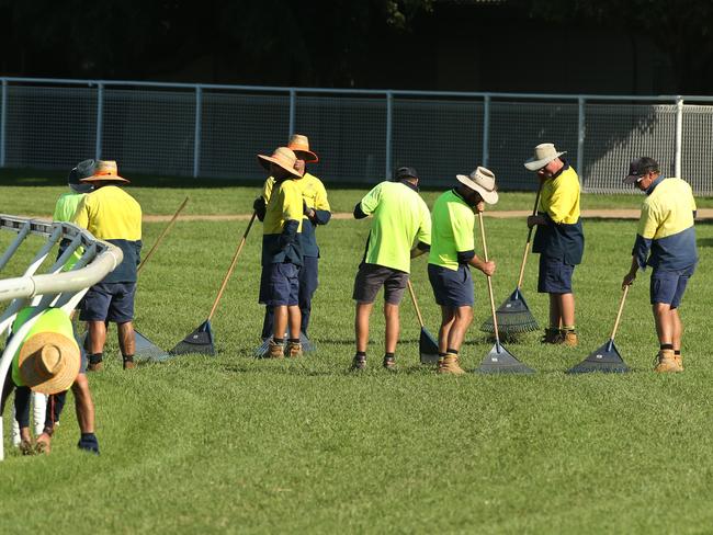 Damage control: track workers repair the course proper at Eagle Farm on Monday.