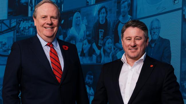 CEO Mike Sneesby (right, pictured with chairman Peter Costello) has told staff to report inappropriate behaviour in the workplace. Picture: James Brickwood