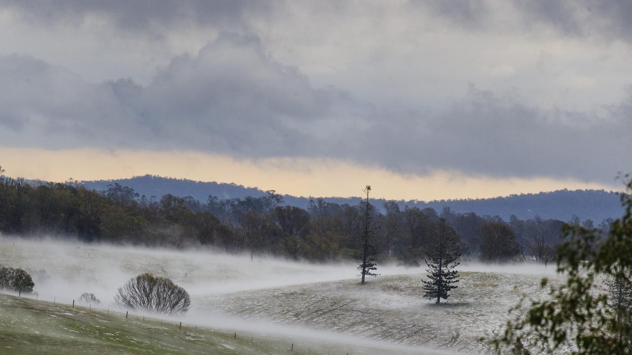 Properties at Long Flat south of Gympie resemble snowfields after a super cell dumped hail, tore down trees and caused devastation across the Burnett and South East. Photo Lachie Millard