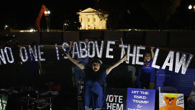 Protesters outside the White House, calling on authorities to impeach President Donald Trump. Picture: Carolyn Kaster