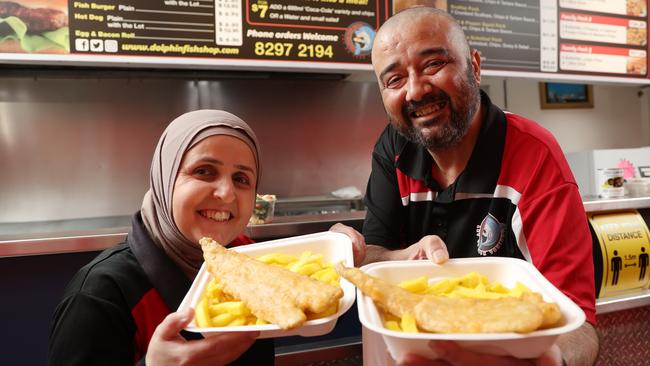 Allan and Samar Hamoudan pose for a photo in their takeaway store Dolphin Fish Shop at Netley, which was named SA’s winner at The Great Australian Fish &amp; Chip Awards. Picture: NCA NewsWire / David Mariuz