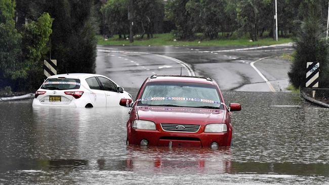 East coast flood damage drove up insurance prices - and demand for used cars. Photo:Muhammad FAROOQ / AFP