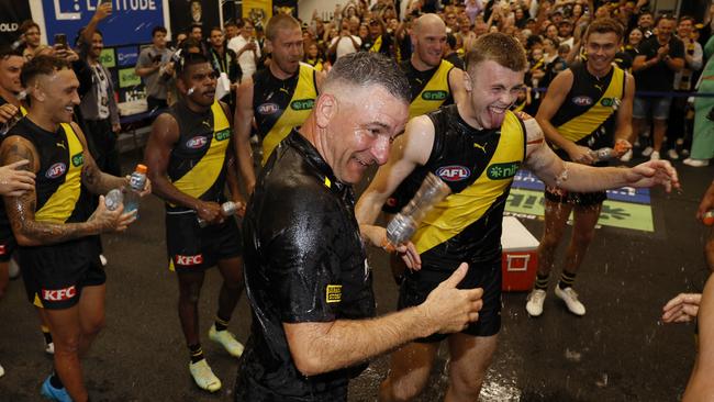 MELBOURNE , AUSTRALIA. March 31 , 2024.  AFL Round 3. Richmond vs Sydney Swans at the MCG.   Adam Yze, Senior Coach of the Tigers cops a gatorade drenching after his 1st win in charge   . Pic: Michael Klein