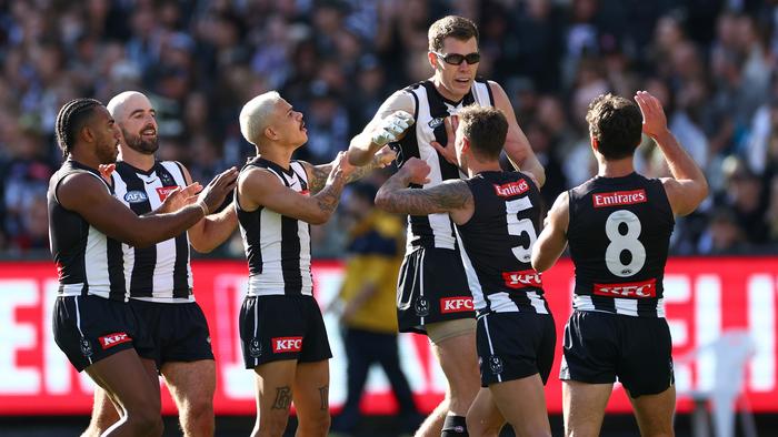 MELBOURNE, AUSTRALIA - APRIL 20: Mason Cox of the Magpies is congratulated by team mates after kicking a goal during the round six AFL match between Collingwood Magpies and Port Adelaide Power at Melbourne Cricket Ground, on April 20, 2024, in Melbourne, Australia. (Photo by Quinn Rooney/Getty Images)