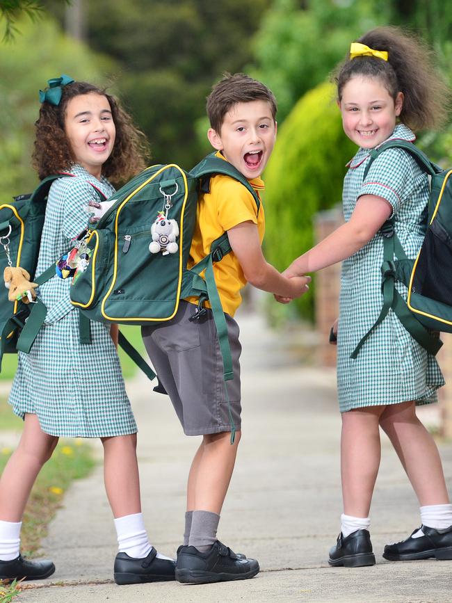 Esta Calafati, 7, Matteo Calafati, 8 and Leah Tempone, 7, are ready for their first day back at St Oliver's Plunkett Primary School. Picture: Nicki Connolly