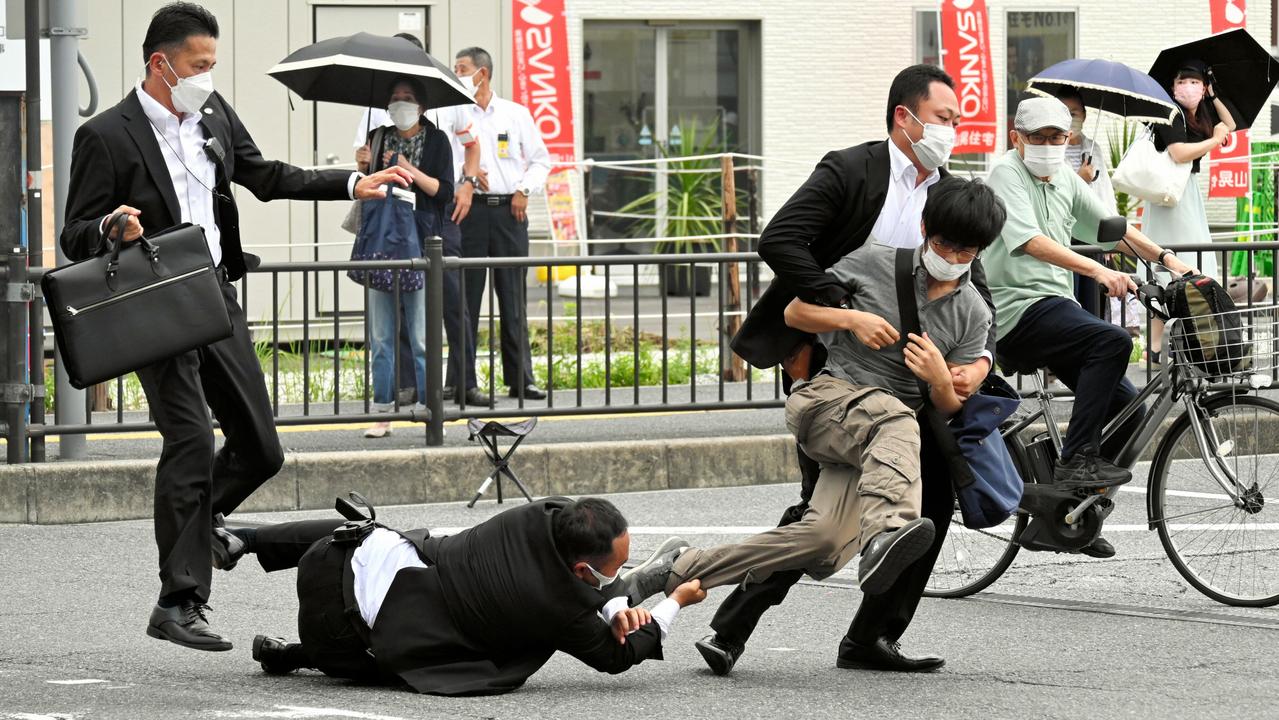 Security police tackle a suspect who is believed to be the shooter. Picture: Getty Images