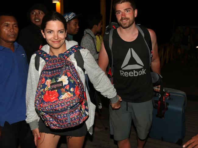 Australian Giovanna Ferraioli (L) and her partner Damien La Cava part of tourist evacuate from Gili Trawangan in Lombok to Bali. Picture: Lukman S Bintoro