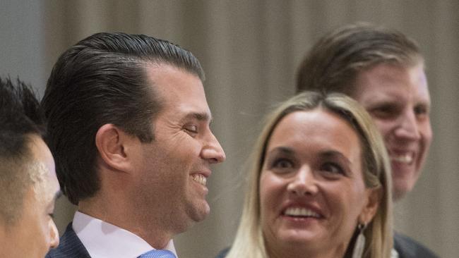 FILE - In this Feb. 28, 2017 file photo, Donald Trump Jr. jokingly plays with scissors as his wife Vanessa laughs at the grand opening of the Trump International Hotel and Tower in Vancouver, Canada. A public court record filed Thursday, March 15, 2018 in New York says Vanessa Trump is seeking an uncontested divorce from the president's son. Details of the divorce complaint haven't been made public. (Jonathan Hayward/The Canadian Press via AP, File)