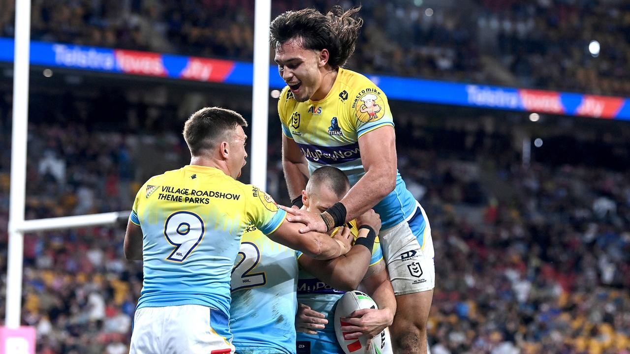 BRISBANE, AUSTRALIA - MAY 07: Kieran Foran of the Titans celebrates with teammates after scoring a try during the round 10 NRL match between Gold Coast Titans and Parramatta Eels at Suncorp Stadium on May 07, 2023 in Brisbane, Australia. (Photo by Bradley Kanaris/Getty Images)