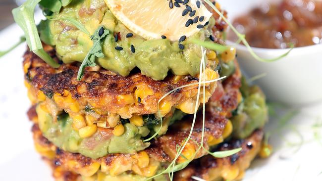 A sweet corn fritter stack with avocado salsa at The Journal Cafe. Photo: Richard Gosling