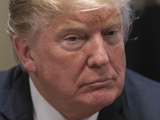 TOPSHOT - US President Donald Trump speaks about his meeting with Russian President Vladimir Putin ahead of a meeting with Republican lawmakers and cabinet members on tax cuts at the White House in Washington, DC, on July 17, 2018. / AFP PHOTO / NICHOLAS KAMM