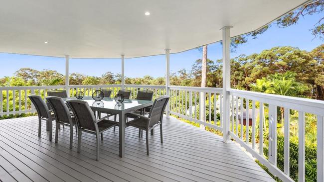 Every room in the house is a short step away from a lush forest view.