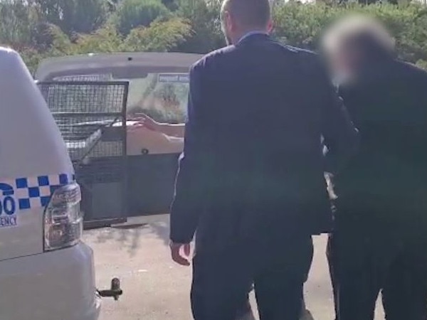 The man is led into custody by police. Picture: NSW Police