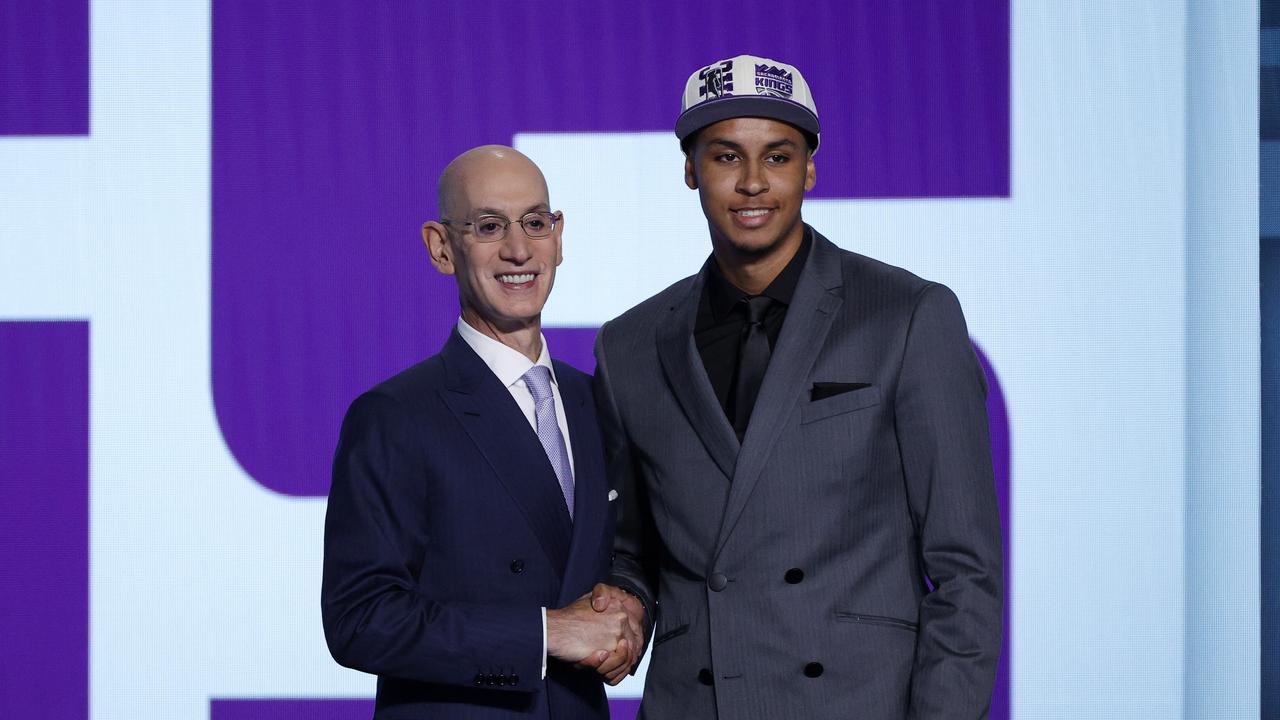 NBA commissioner Adam Silver and Keegan Murray pose for photos. (Photo by Sarah Stier/Getty Images)