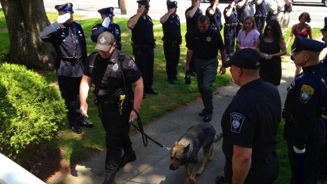 Kaiser gets a guard of honour during his final walk with his fellow police officers. Picture: Facebook