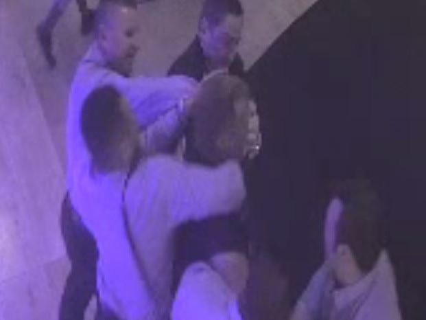 A still from CCTV footage showing a man being grabbed by bouncers at a Cairns casino.