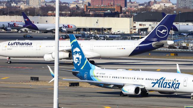 A Boeing 737-900er passengers aircraft of Alaska Airlines on its way to San Francisco is seen before take-off at John F. Kennedy Airport on January 8, 2024. Shares of Boeing plunged early Monday after an airplane panel blew out mid-flight, reviving safety questions at a time when the company hoped to recover its reputation. (Photo by Charly TRIBALLEAU / AFP)