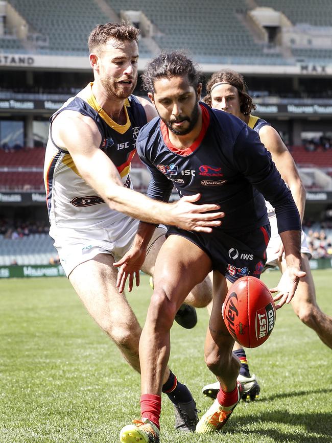 Crows veteran Andy Otten tracks Anthony Wilson to the footy. Picture SARAH REED