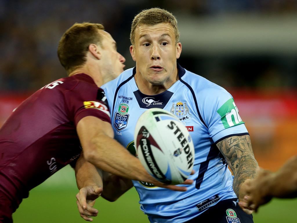 Former Blues Origin halfback Trent Hodkinson offloads helped Croker during his recover. Picture: Gregg Porteous