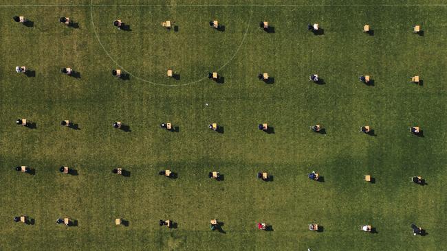 Applicants take written examination during a recruitment test for Ansan Urban Corporation at the Wa stadium in Ansan, South Korea, Saturday, April 4.