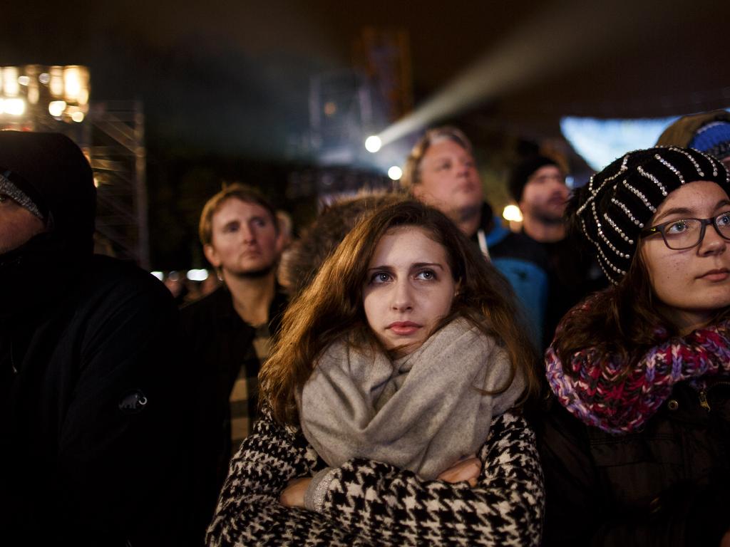 Visitors gather to watch anniversary celebrations in Berlin. Picture: Carsten Koall/Getty Images