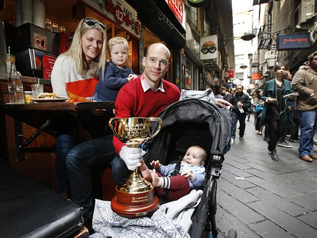 Simon, Gaynor, Jarvis and Jack from Warrandyte have lunch with the Cup in Degraves Street. Picture: David Caird