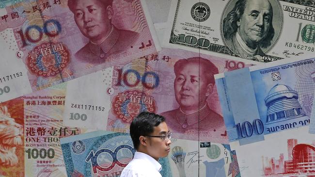 China's has fallen through the politically sensitive level of seven to the US currency. Picture: AFP