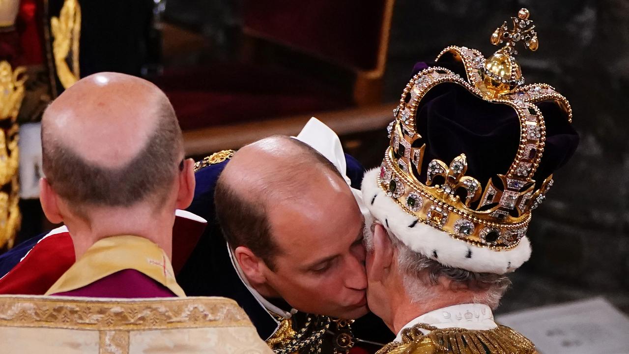 Prince William kisses his father, King Charles during the King's Coronation. Picture: Yui Mok – WPA Pool/Getty Images