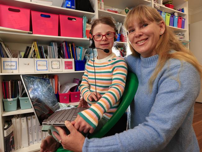 Megan Messer and her 11-year-old daughter Amy using the Voicitt program. Picture: Adam Head