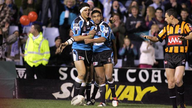 Vince Mellars, left, after scoring the winning try for Cronulla Pic: MARK EVANS