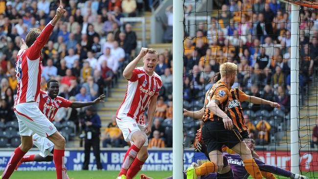 Stoke City's Ryan Shawcross, centre, jubilates after scoring his teams first goal.