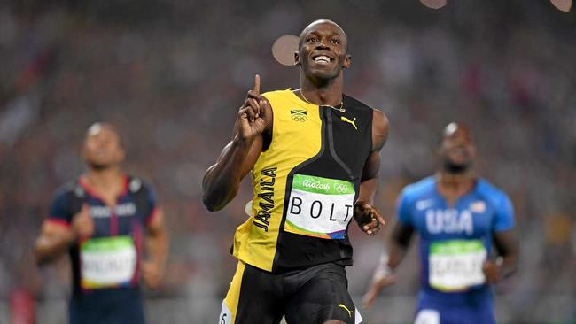 GOLD: Jamaican superstar and fastest man on earth, Usain Bolt wins the Men's 100m final at his third consecutive Olympics. Picture: Shaun Botterill