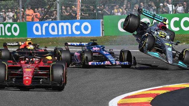 Mercedes' British driver Lewis Hamilton (R) collides with Alpine's Spanish driver Fernando Alonso