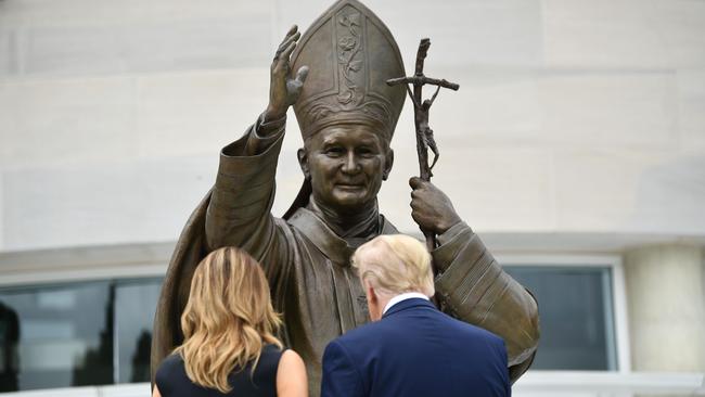 US President Donald Trump and First Lady Melania Trump visit the Saint John Paul II National Shrine, to lay a ceremonial wreath and observe a moment of remembrance under the Statue of Saint John Paul II in Washington DC.