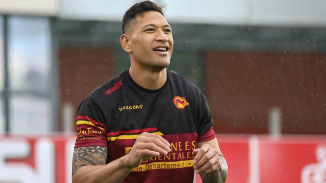 Australian rugby player Israel Folau smiles during a training session with his new club Catalan Dragons in Perpignan, France, Wednesday Feb. 5, 2020. Folau, one of the world's top rugby players, was fired by Rugby Australia over an Instagram post in April in which he condemned "drunks, homosexuals" and warned "hell awaits" them. (Catalan Dragons via AP)