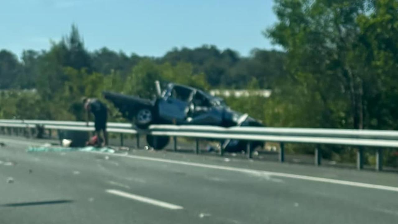 A car has crashed over the barrier on the off ramp from the Bruce Highway at Tanawha. Photo: Chris Anderson-Gray