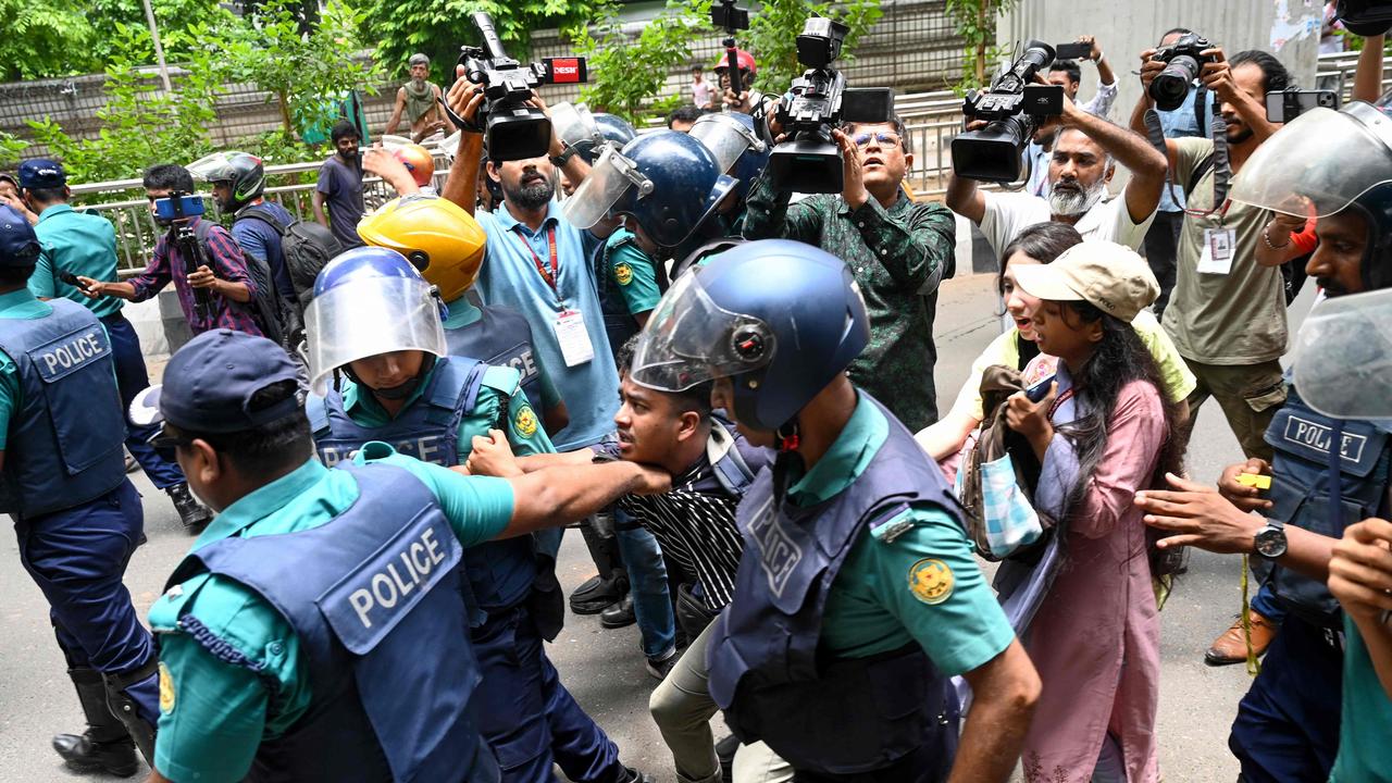 Bangladesh police scuffle with people as they protest to demand justice for the victims killed in the recent countrywide violence. Picture: Munir Uz Zaman/AFP