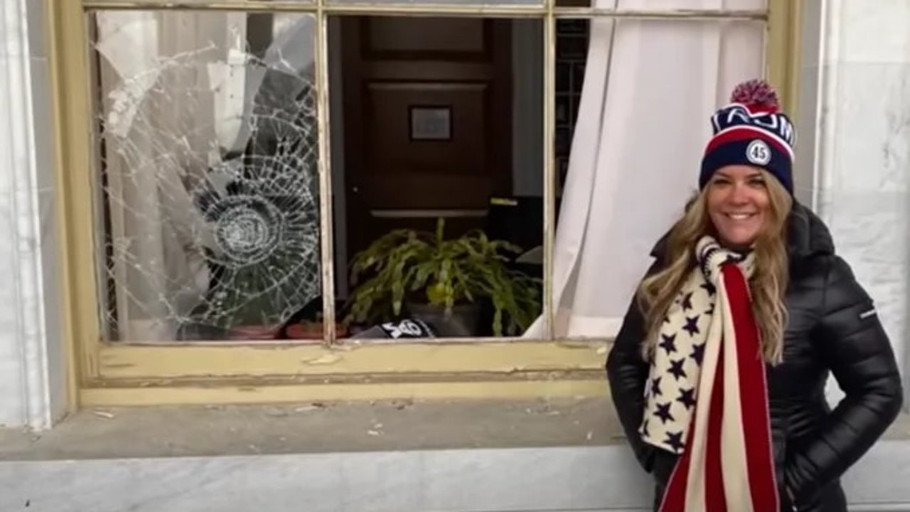 Jenna Ryan shared a photo standing outside a building in the Capitol complex that had been damaged by rioters. Picture: U.S. Attorney's Office.