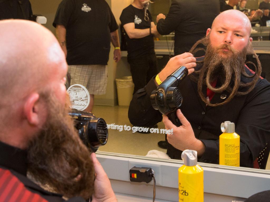 A competitor prepares his beard during the 2017 Remington Beard Boss World Beard and Moustache Championships held at the Long Center for the Performing Arts on September 3, 2017 in Austin, Texas. PIcture: AFP