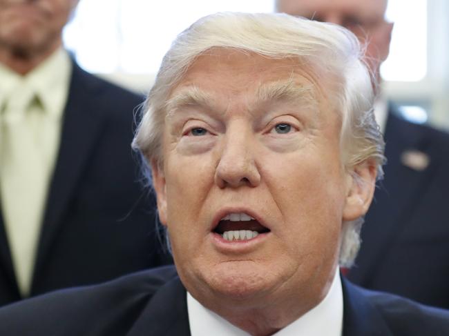 FILE - In this Jan. 28, 2017 file photo, President Donald Trump speaks in the Oval Office at the White House in Washington. President Donald Trump has moved to concentrate major decision-making in the hands of a few close aides, even reorganizing national security meetings to include a political adviser. (AP Photo/Alex Brandon, File)