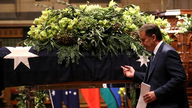 Lou Richards State Funeral at St Paul's Cathedral in Melbourne. Tony Jones walks past the casket. POOL POSITION. Picture: Alex Coppel.