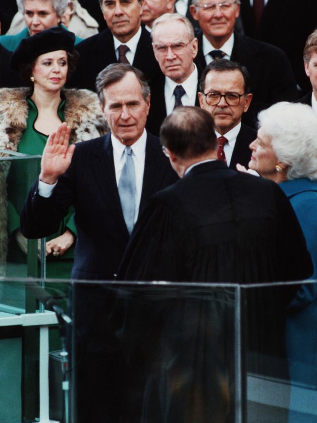 George Bush raises his right hand as he repeats the Oath of Office in 1989. Picture: Getty Images