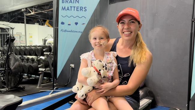 Chelsea with her mother Tracey Johnson. Chelsea endured more than 15 surgeries to treat her brain cancer in 2022. Picture: supplied.