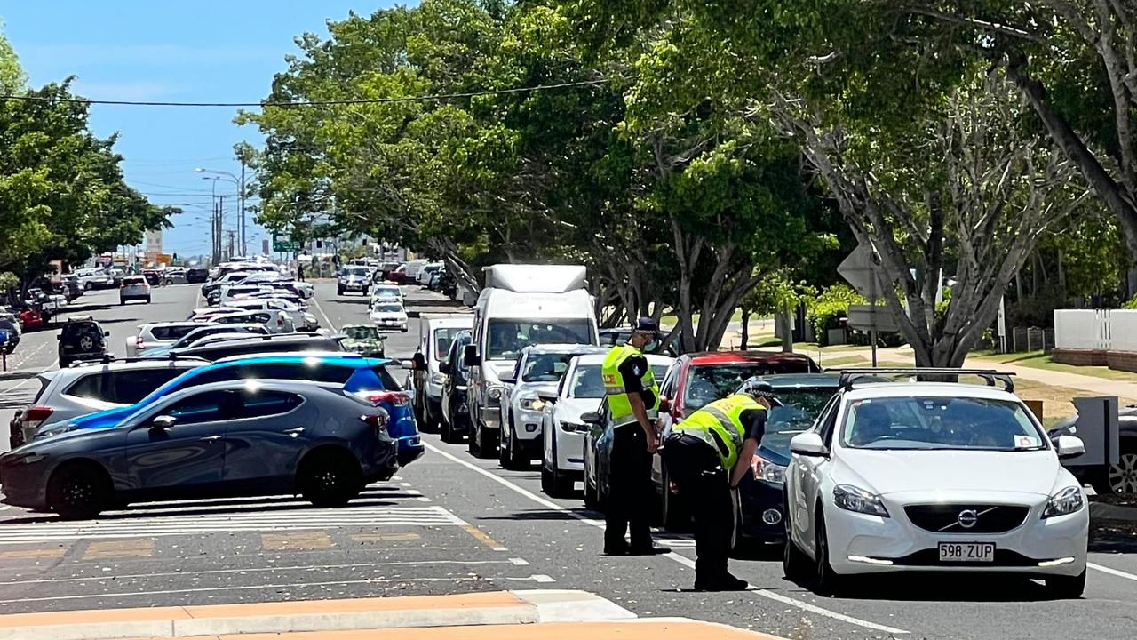 Cars were turned away at the Bundaberg Hospital fever clinic by Police on Christmas Eve after a surge in close contact sites.